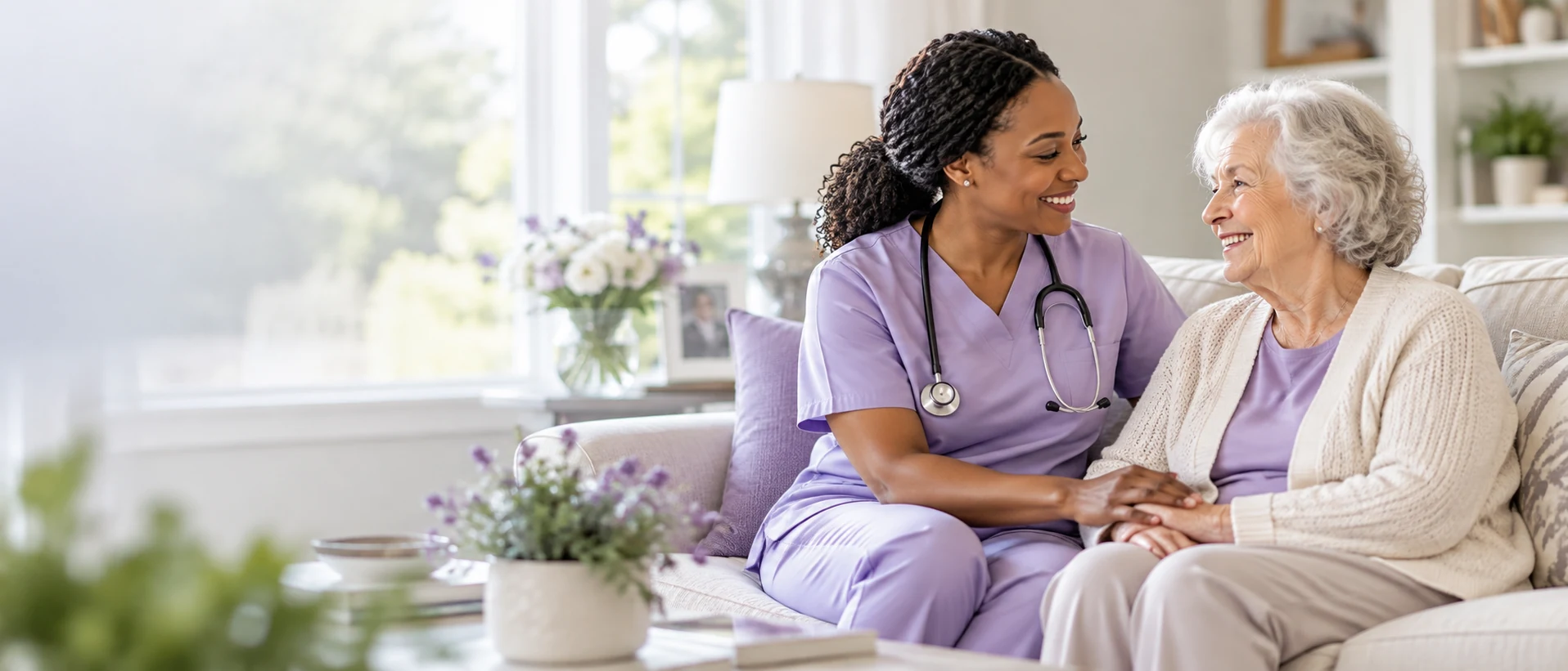Home health nurse sharing a warm conversation with an older adult at home